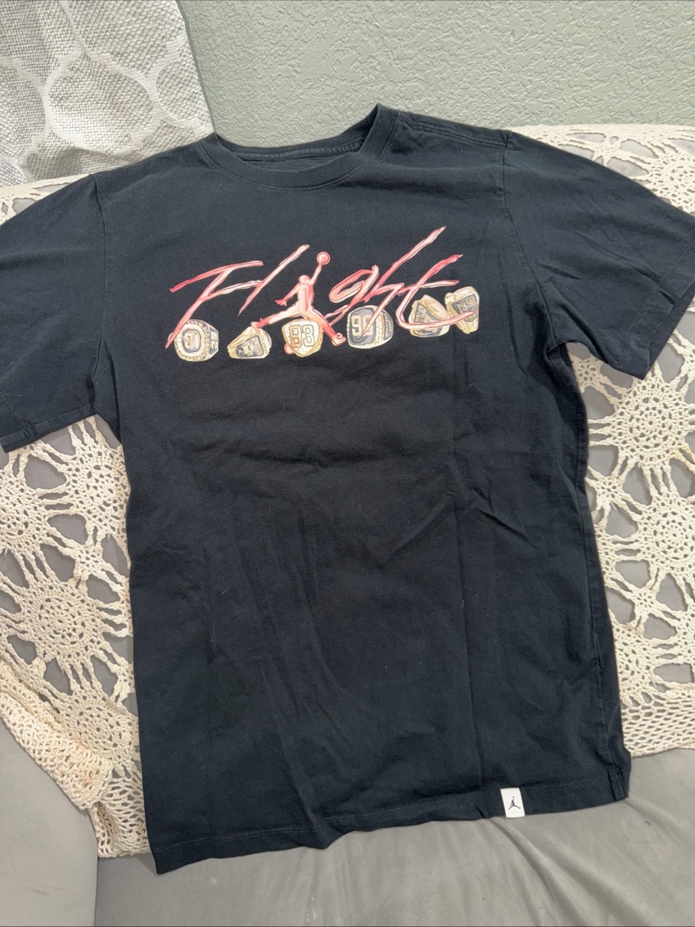 Jordan Black Tee with Pink Flight Script and Gold Ring Icons